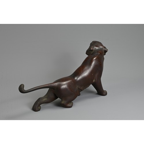 306 - A LATE 19TH/EARLY 20TH CENTURY JAPANESE BRONZE OKIMONO OF A TIGER BY NOBUMITSU. Naturalistically cas... 