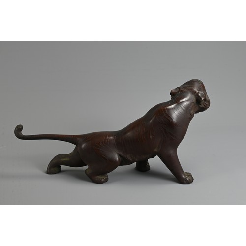 306 - A LATE 19TH/EARLY 20TH CENTURY JAPANESE BRONZE OKIMONO OF A TIGER BY NOBUMITSU. Naturalistically cas... 