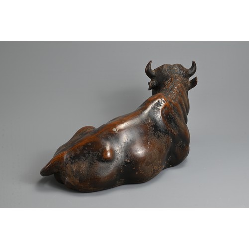 309 - A LARGE JAPANESE LATE MEIJI PERIOD (1868-1912) BRONZE MODEL OF A RECUMBENT COW. Naturalistically mod... 