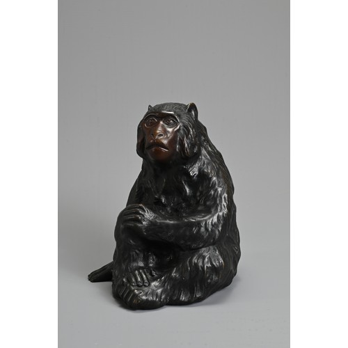 303 - A 20TH CENTURY JAPANESE BRONZE OKIMONO OF A MONKEY BY HIDEYAMA. Naturalistically modelled seated, wi... 