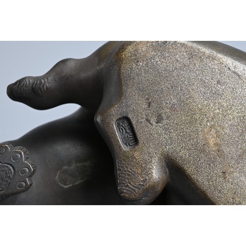 304 - AN EARLY 20TH CENTURY JAPANESE BRONZE OF TWO PUPPIES PLAYING. Signed Tokutani with seal mark to unde... 