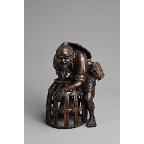 282 - A JAPANESE CARVED WOOD MODEL OF A FISHERMAN, PROBABLY LATE 19TH/20TH CENTURY. Modelled bent over, le... 