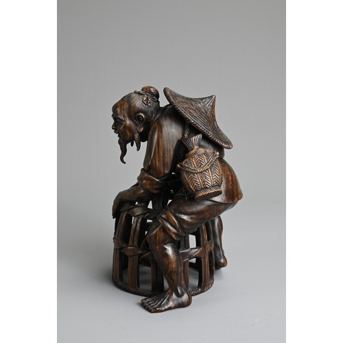 282 - A JAPANESE CARVED WOOD MODEL OF A FISHERMAN, PROBABLY LATE 19TH/20TH CENTURY. Modelled bent over, le... 