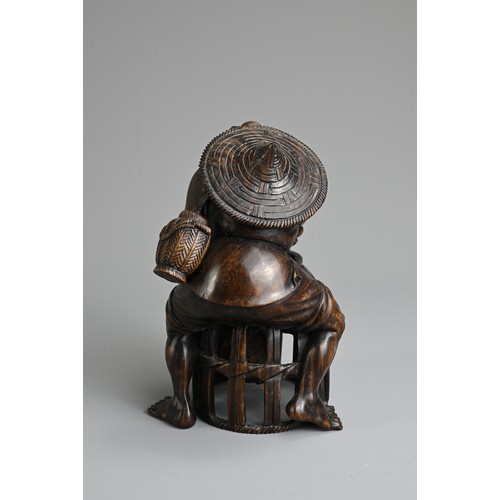 282 - A JAPANESE CARVED WOOD MODEL OF A FISHERMAN, PROBABLY LATE 19TH/20TH CENTURY. Modelled bent over, le... 