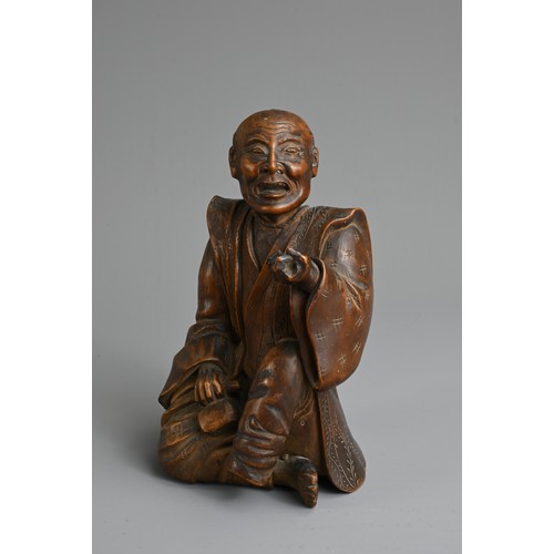 283 - A JAPANESE MEIJI PERIOD (1868-1912) CARVED WOOD OKIMONO OF AN SEATED ELDERLY GENTLEMAN. Modelled sea... 