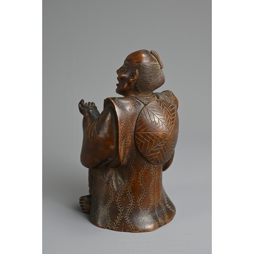 283 - A JAPANESE MEIJI PERIOD (1868-1912) CARVED WOOD OKIMONO OF AN SEATED ELDERLY GENTLEMAN. Modelled sea... 