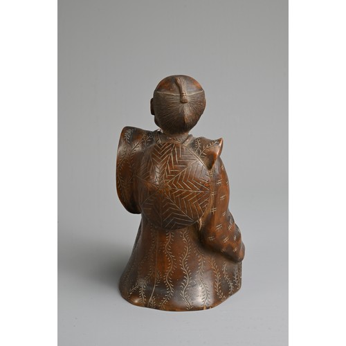 283 - A JAPANESE MEIJI PERIOD (1868-1912) CARVED WOOD OKIMONO OF AN SEATED ELDERLY GENTLEMAN. Modelled sea... 