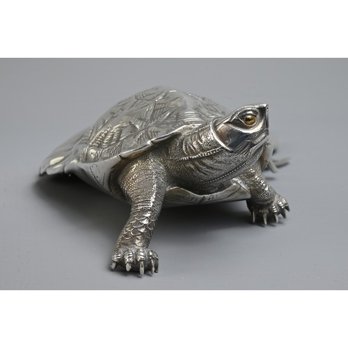 284 - A 20TH CENTURY JAPANESE SILVER OKIMONO OF A MINOGAME. The mythical turtle depicted with a typical lo... 