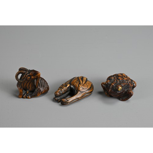 279 - THREE 19TH CENTURY JAPANESE CARVED BOXWOOD NETSUKE. Comprising: a model of a goat, signed Kokei (Kuw... 