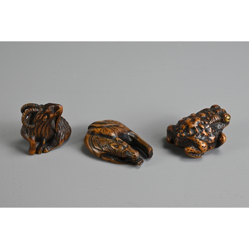 279 - THREE 19TH CENTURY JAPANESE CARVED BOXWOOD NETSUKE. Comprising: a model of a goat, signed Kokei (Kuw... 