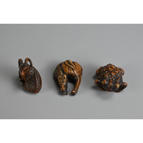 279 - THREE 19TH CENTURY JAPANESE CARVED BOXWOOD NETSUKE. Comprising: a model of a goat, signed Kokei (Kuw... 