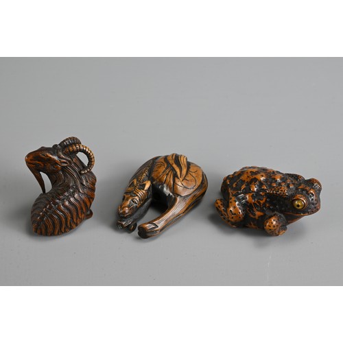 279 - THREE 19TH CENTURY JAPANESE CARVED BOXWOOD NETSUKE. Comprising: a model of a goat, signed Kokei (Kuw... 