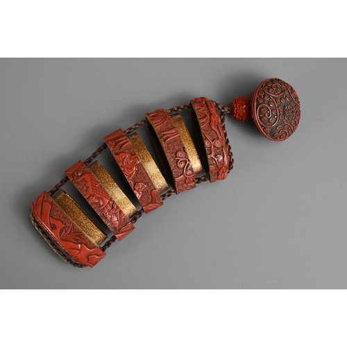 276 - A JAPANESE MEIJI PERIOD (1868-1912) RED LACQUER INRO. With red lacquer manju netsuke and ojime ensem... 