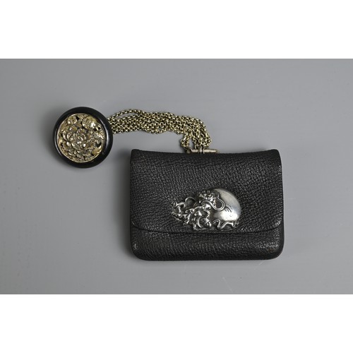 278 - A JAPANESE MEIJI PERIOD (1868-1912) BLACK LEATHER COIN POUCH (FUKURO) WITH SILVER-COLOURED METAL CLA... 