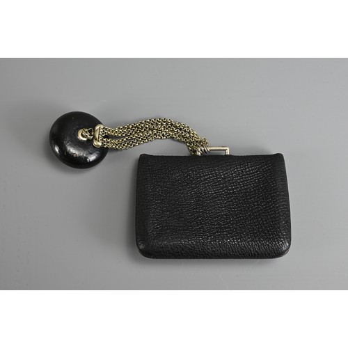 278 - A JAPANESE MEIJI PERIOD (1868-1912) BLACK LEATHER COIN POUCH (FUKURO) WITH SILVER-COLOURED METAL CLA... 