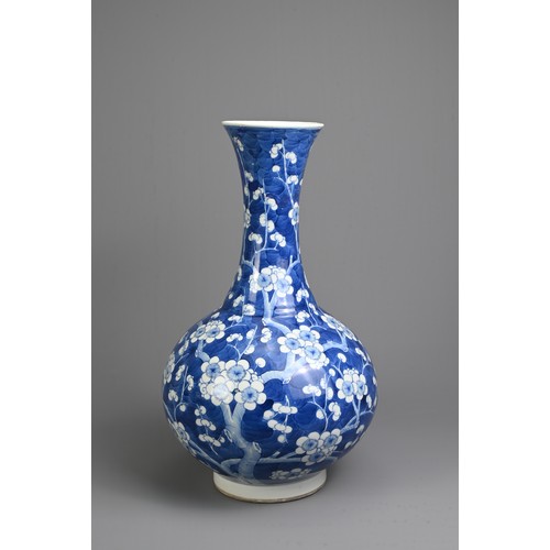 49 - A CHINESE BLUE AND WHITE PORCELAIN PRUNUS BOTTLE VASE, 19TH CENTURY. With globular body and flared n... 