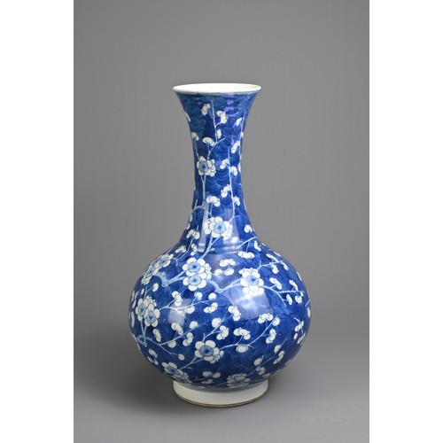 49 - A CHINESE BLUE AND WHITE PORCELAIN PRUNUS BOTTLE VASE, 19TH CENTURY. With globular body and flared n... 