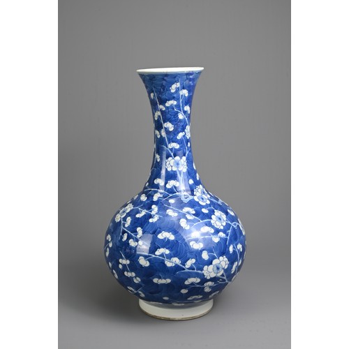 49 - A CHINESE BLUE AND WHITE PORCELAIN PRUNUS BOTTLE VASE, 19TH CENTURY. With globular body and flared n... 