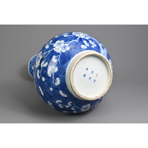 49 - A CHINESE BLUE AND WHITE PORCELAIN PRUNUS BOTTLE VASE, 19TH CENTURY. With globular body and flared n... 