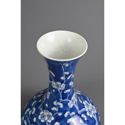 49 - A CHINESE BLUE AND WHITE PORCELAIN PRUNUS BOTTLE VASE, 19TH CENTURY. With globular body and flared n... 