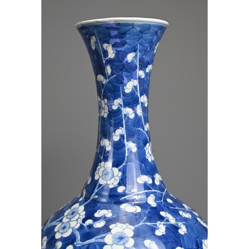 49 - A CHINESE BLUE AND WHITE PORCELAIN PRUNUS BOTTLE VASE, 19TH CENTURY. With globular body and flared n... 