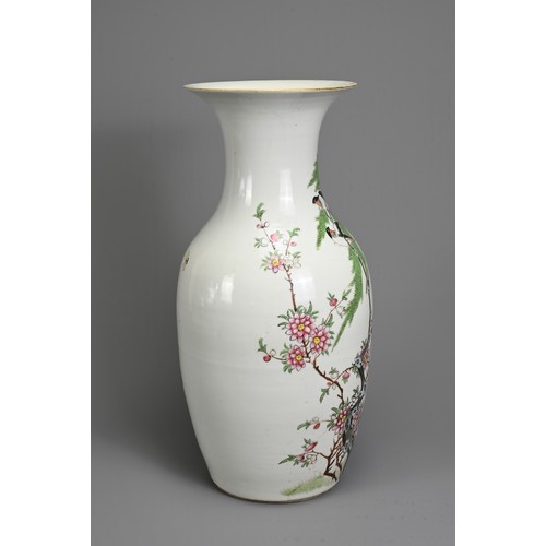 52 - A CHINESE FAMILLE ROSE PORCELAIN VASE, 20TH CENTURY. Of baluster form decorated with birds perched i... 