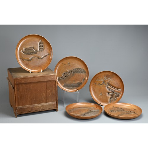 299 - FIVE 20TH CENTURY JAPANESE SENCHA (TEA CEREMONY) CARVED WOODEN CIRCULAR TRAYS. Each carved with a di... 