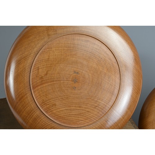 299 - FIVE 20TH CENTURY JAPANESE SENCHA (TEA CEREMONY) CARVED WOODEN CIRCULAR TRAYS. Each carved with a di... 