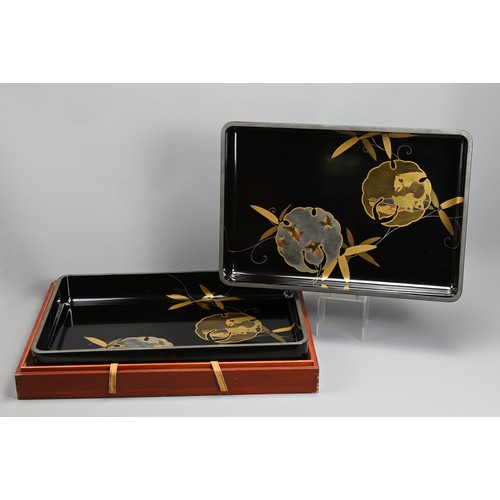 300 - A PAIR OF EARLY 20TH CENTURY JAPANESE NESTED LACQUER TRAYS BY TOKIWAYA KOHEI. Decorated in gold and ... 