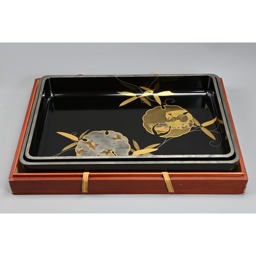 300 - A PAIR OF EARLY 20TH CENTURY JAPANESE NESTED LACQUER TRAYS BY TOKIWAYA KOHEI. Decorated in gold and ... 