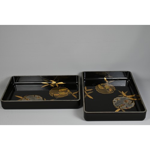 300 - A PAIR OF EARLY 20TH CENTURY JAPANESE NESTED LACQUER TRAYS BY TOKIWAYA KOHEI. Decorated in gold and ... 