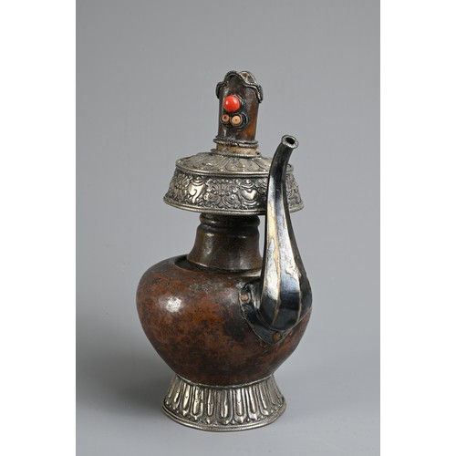 97 - A TIBETAN COPPER AND SILVER EWER, BUMPA, 19/20TH CENTURY. With copper body and splayed silver foot a... 