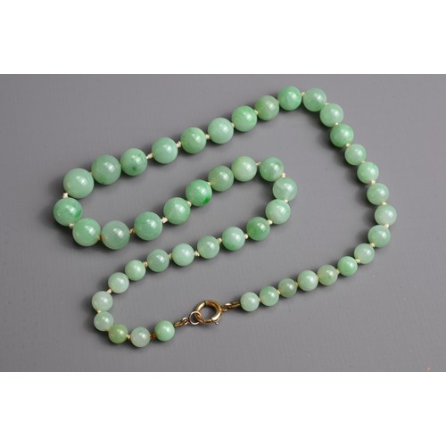 119 - A GROUP OF CHINESE JADE JADEITE JEWELLERY ITEMS, EARLY 20TH CENTURY. To include a graduating circula... 