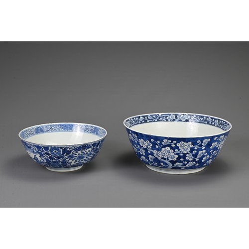 23 - TWO CHINESE BLUE AND WHITE PORCELAIN BOWLS, 19TH CENTURY. To include a large punch bowl decorated wi... 