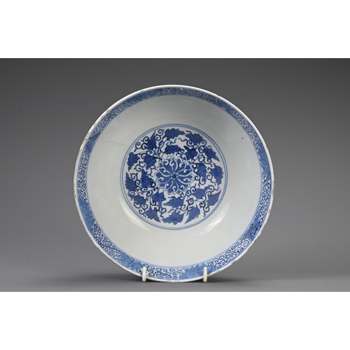 23 - TWO CHINESE BLUE AND WHITE PORCELAIN BOWLS, 19TH CENTURY. To include a large punch bowl decorated wi... 