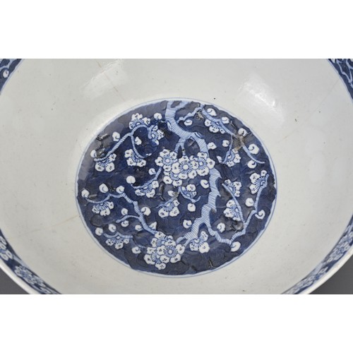 23 - TWO CHINESE BLUE AND WHITE PORCELAIN BOWLS, 19TH CENTURY. To include a large punch bowl decorated wi... 