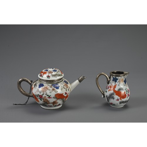 26 - A CHINESE FAMILLE ROSE EXPORT PORCELAIN TEAPOT AND MILK JUG, 18TH CENTURY. Decorated with goldfish a... 