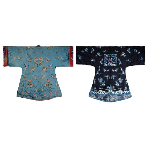 190 - TWO CHINESE EMBROIDERED BLUE GROUND SILK ROBES, CIRCA 1900 AND LATER. The first, earlier example, of... 