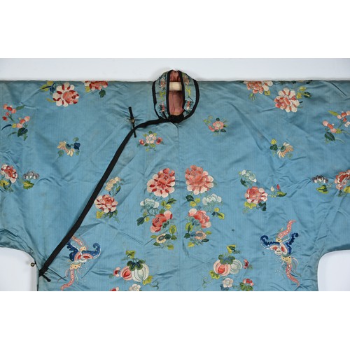 190 - TWO CHINESE EMBROIDERED BLUE GROUND SILK ROBES, CIRCA 1900 AND LATER. The first, earlier example, of... 