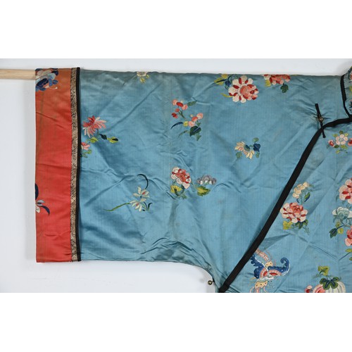 190 - TWO CHINESE EMBROIDERED BLUE GROUND SILK ROBES, CIRCA 1900 AND LATER. The first, earlier example, of... 