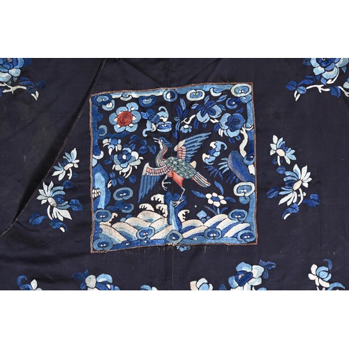 190 - TWO CHINESE EMBROIDERED BLUE GROUND SILK ROBES, CIRCA 1900 AND LATER. The first, earlier example, of... 