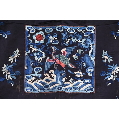 190 - TWO CHINESE EMBROIDERED BLUE GROUND SILK ROBES, CIRCA 1900 AND LATER. The first, earlier example, of... 