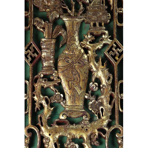 195 - A SET OF FOUR MONUMENTAL CHINESE CARVED WOOD DOOR PANELS, LATE QING / REPUBLIC PERIOD. Each of tall ... 