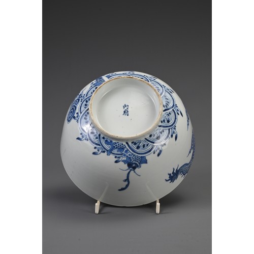 27 - THREE CHINESE BLUE AND WHITE PORCELAIN BOWLS, 18/19TH CENTURY. The largest decorated with carp and w... 