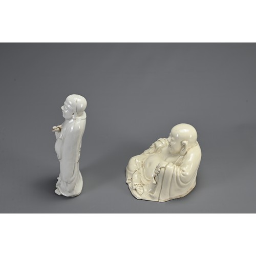 37 - TWO CHINESE BLANC DE CHINE FIGURES, 18/19TH CENTURY. To include a figure of Buddha stood dressed in ... 