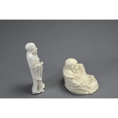 37 - TWO CHINESE BLANC DE CHINE FIGURES, 18/19TH CENTURY. To include a figure of Buddha stood dressed in ... 