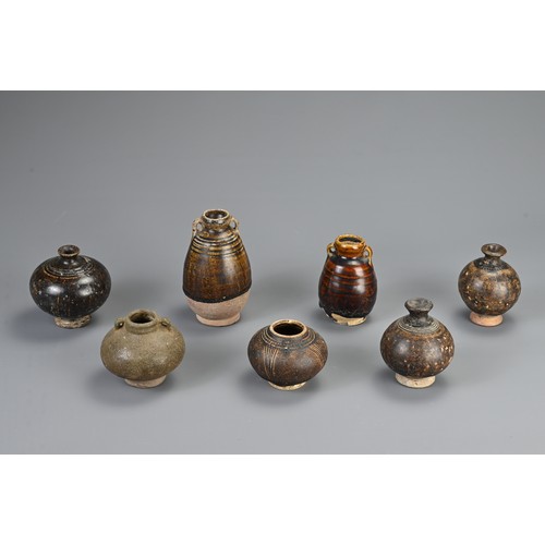 42 - A GROUP OF SOUTH EAST ASIAN BROWN GLAZED POTTERY ITEMS, 12/13TH CENTURY. Of varying forms and sizes.... 