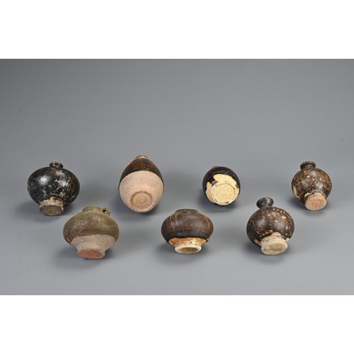 42 - A GROUP OF SOUTH EAST ASIAN BROWN GLAZED POTTERY ITEMS, 12/13TH CENTURY. Of varying forms and sizes.... 