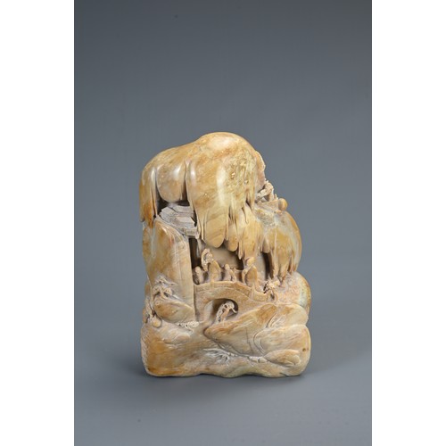 45 - A CHINESE CARVED SOAPSTONE BOULDER, 20TH CENTURY. Carved both sides in deep relief with figures on a... 