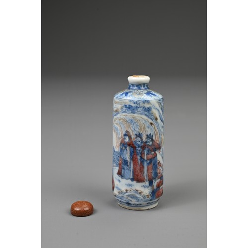 54 - A CHINESE UNDERGLAZE BLUE AND COPPER RED PORCELAIN SNUFF BOTTLE, 19TH CENTURY. Of cylindrical form d... 